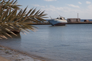 shipwreck in old harbor at the Red Sea coast