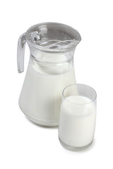 Glass jug with milk on white background