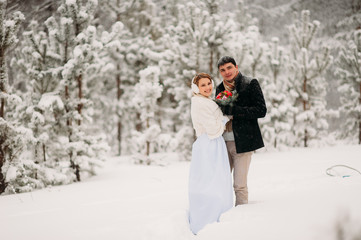 couple in a pine forest