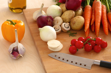 Pile of organic vegetables on a wooden table