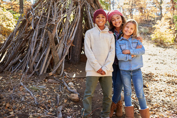 Group Of Children Playing In Forest Camp Together