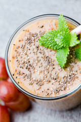 Grape smoothie, on the grey  background.