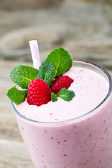 Raspberry milk shake with mint decor.