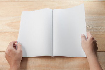 hand open blank. book or magazines, .book mock up on wood backgr