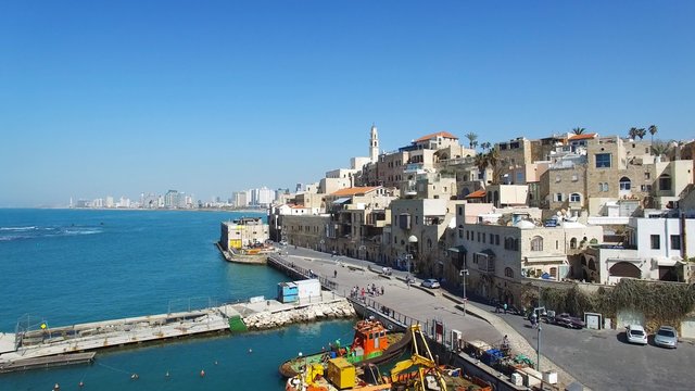 Aerial footage of the old city of Jaffa and tel Aviv skyline