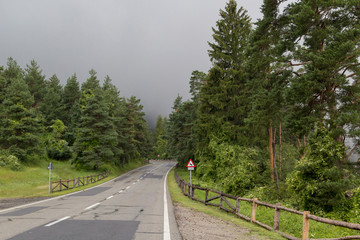 Fototapeta na wymiar Mountain road on a rainy day