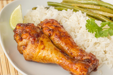 Indonesian chicken drumsticks with rice, lime and sajoer beans