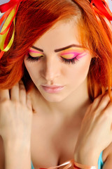 Beautiful red-hair girl with creative makeup