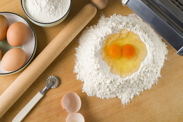 raw egg pasta with flour and rolling pin