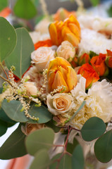 Spring flowers. Orange bouquet with carnations and tulips.