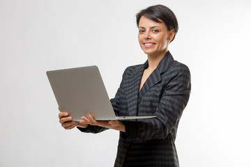 Young attractive business woman in a studio