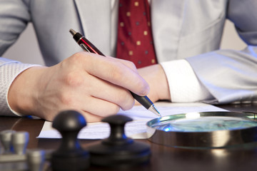 Notary signs the documents from our office