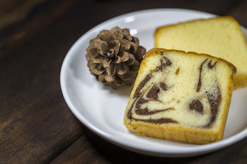 Butter cake, marble butter cake on white plate - selective focus