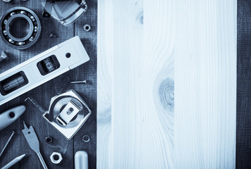 Obraz premium work tools and instruments on wood