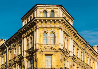 Fototapeta na wymiar Corner of old apartment building facade in St. Petersburg, Russia.