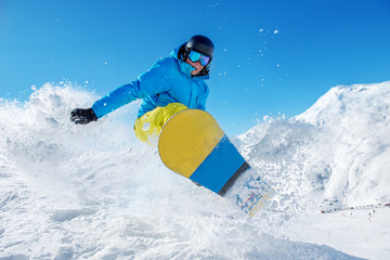 Active snowboarder jumping - 104834353