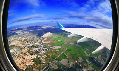 Obraz premium View from airplane window on fields and mountains, Cappadocia ,