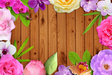 Beautiful flower blossom and leaf frame on brown wood background