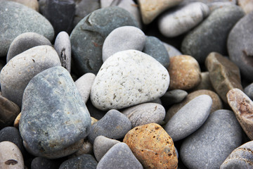 Fototapeta na wymiar sea pebbles round stones natural background