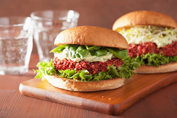 veggie beet and quinoa burger with avocado dressing