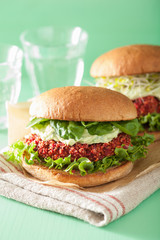 veggie beet and quinoa burger with avocado dressing