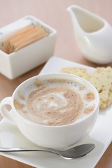 Cup with fresh cappuccino