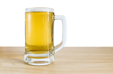 Frosty glass of light beer on wooden with white background