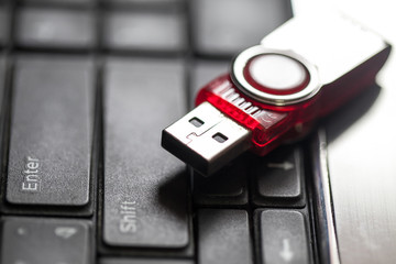 USB storage drive on computer keyboard