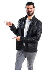 Man with leather jacket pointing to the lateral