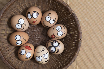 Eight egg face in round wicker basket