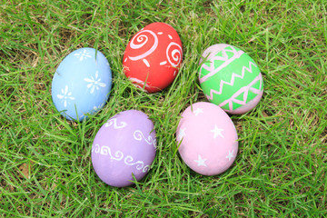 Top view of easter eggs on green grass