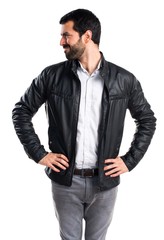 Fototapeta premium Man with leather jacket looking lateral