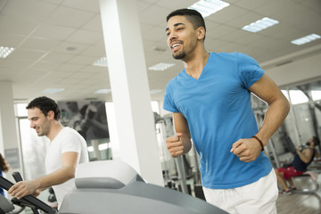 Fototapeta na wymiar Young multiracial men in the gym