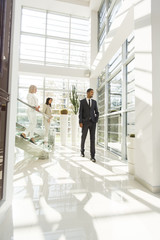 Young people walking in the office