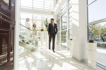 Young people walking in the office