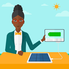 Solar panel charging tablet computer.