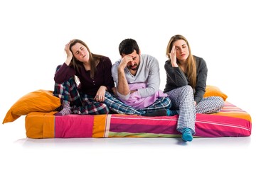 frustrated friends on a bed