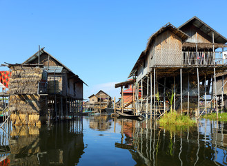 Fototapeta na wymiar Stilted houses in village on Inle lake