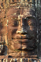 Giant stone face at Bayon Temple in Cambodia