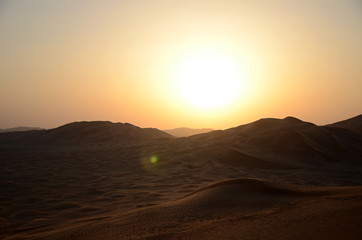 Fototapeta na wymiar Sun over sand dunes Shara desert