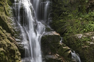 Fototapeta na wymiar Kamienczyk waterfall in the mountains, Karkonosze, Giant Mountains