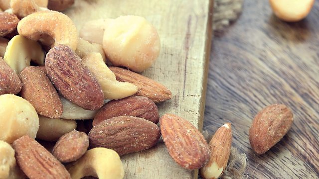 Heap of rotating mixed Nuts (not loopable 4K footage)