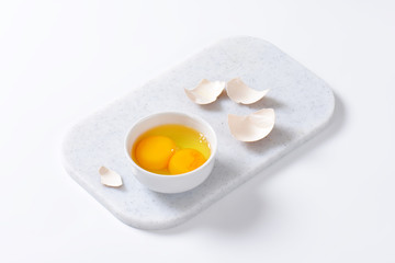 Egg whites and yolks in bowl
