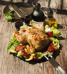  baked chicken with herbs spices ingredients, selective focus