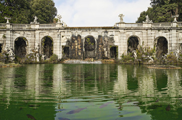 Fototapeta premium Caserta Royal Palace and his gardens - fountain with statues and water reflections