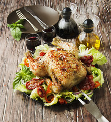  baked chicken with herbs spices ingredients, selective focus