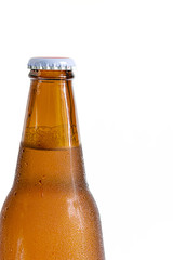 Bottle of beer with drops on a white background,Close up part of the bottle