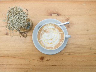 Close up cup of Coffee, latte on the wooden table