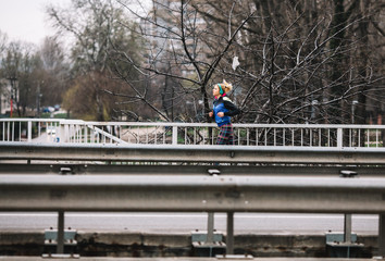 Fototapeta premium Female in sports wear jogging in city environment.