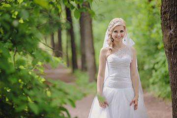 Fototapeta na wymiar Photo beautiful bride outdoors in a forest.